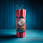High contrast image of a time bomb on a wooden background